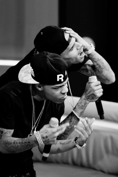 Bow Wow and another artist performing passionately with microphones in hand.